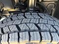 Close-up of a tread pattern on a tire of a 2024 Mercedes-Benz Sprinter 2500 showing detailed grooves and rubber texture