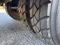 Close-up of a 2006 Freightliner M2 106 tire showing deep tread patterns and sidewall details