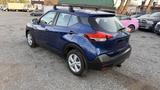 A blue 2019 Nissan Kicks with a roof rack displayed from the rear three-quarter view