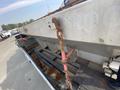 A 2016 RAM 5500 truck with a flatbed and visible rusted components including chains and straps
