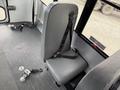 A gray seat with a safety belt designed for use in a passenger vehicle