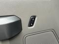 Close-up of a door control panel in a 2018 Ford F-150 featuring lock and unlock buttons