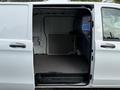 2020 Mercedes-Benz Metris with an open sliding side door revealing a spacious cargo area and a smooth floor surface