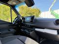 Interior view of a 2023 Mercedes-Benz Sprinter 2500 featuring a dashboard with controls a touchscreen display and spacious seating