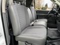 Front seats of a 2008 Sterling Bullet with gray fabric and leather upholstery designed for comfortable seating
