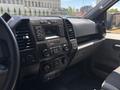 Interior view of a 2019 Ford F-150 showing the dashboard controls audio system and air conditioning settings