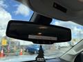 Rearview mirror of a 2018 Chevrolet Colorado displaying vehicle height information and featuring a tree-shaped air freshener hanging below it