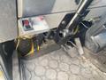 Interior view of a 1997 Freightliner FL70 showing the driver controls with a gear stick and pedals in the foreground