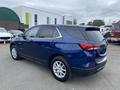 A blue 2022 Chevrolet Equinox parked with a sleek design and modern features visible such as alloy wheels and rear LED lights