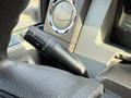 Close-up of a 2015 Ford F-550 steering column showing controls for headlights and windshield wipers