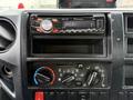 Dashboard of a 2015 Hino 195 featuring a Pioneer car stereo and control knobs for air conditioning and heating