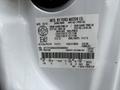 A white 2013 Ford F-250 SD vehicle identification label displaying manufacturing details and specifications