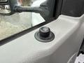 Close-up of a control knob on the door panel of a 2024 Ford E-450 indicating vehicle features like locking or window adjustments