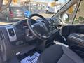Interior of a 2020 RAM ProMaster 3500 featuring a steering wheel dashboard and controls with seats and floor mat visible