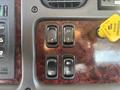 Control panel of a 2022 Freightliner M2 106 featuring switches for mirror heat door locks and an air brake release handle