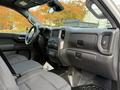 Interior view of a 2024 Chevrolet Silverado 1500 showcasing the dashboard front seats and center console