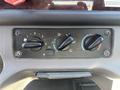 Control panel featuring four knobs for climate control settings in a 2022 Freightliner M2 106