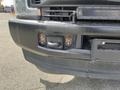 Close-up of the front bumper of a 2017 Ford F-250 SD featuring a tow hook and mounting points with visible rust