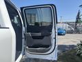 2023 Ford F-350 SD with a partially open rear door revealing the interior details and upholstery
