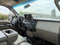 Interior of a 2008 Ford F-550 showcasing the dashboard with controls a touchscreen display and seating area