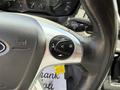 Close-up of the steering wheel controls of a 2016 Ford Transit including audio and voice command buttons