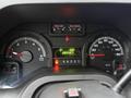 The dashboard of a 2013 Ford E-350 displaying gauges for RPM fuel and speed with a digital odometer reading 682567