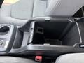 Interior console of a 2017 Chevrolet Colorado with a storage compartment and cup holder