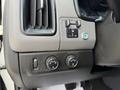 Interior control panel of a 2018 Chevrolet Colorado featuring buttons for headlights and a switch for brightness adjustment