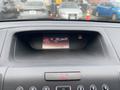Dashboard display of a 2014 Honda CR-V showing the radio station FM 101.1 and the time 5:59