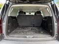 The interior of a 2017 Chevrolet Tahoe with its rear seats folded down showing a spacious cargo area