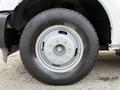 Close-up of a silver wheel and tire from a 2015 Ford F-350 showing the rim details and tread pattern