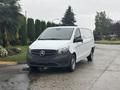 A white 2021 Mercedes-Benz Metris van with black accents parked on a paved surface