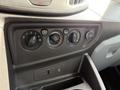 Dashboard controls of a 2016 Ford Transit featuring climate control knobs and a 12V power outlet