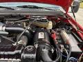 Engine bay of a 2007 Ford F-550 featuring a large air intake system hoses and various engine components in close detail
