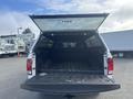 A 2012 RAM 2500 with an open truck bed showing the interior space designed for cargo storage