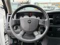 Steering wheel of a 2008 Sterling Bullet with buttons on the sides and a key attached to the ignition switch