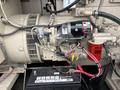 A 2005 Katolight SED60FPJ4 generator's internal components including a motor starter battery and various wires and connectors