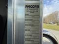 A metal label attached to a vehicle displaying specifications including GVWR GAWR front tire size and rim size details