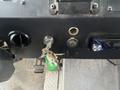 A 2012 Workhorse W62 ignition panel featuring a key slot with keys attached a keyhole and a control knob