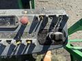Control panel of a 2015 JLG 450AJ with various buttons switches and levers for operating the equipment