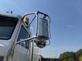 A 2008 Peterbilt 340 truck featuring a polished side mirror and a metallic fuel tank mounted on the side mirror support