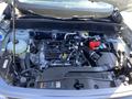 The engine compartment of a 2023 Ford Bronco Sport showcasing various engine components and systems