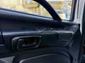 Interior door handle and controls of a 2015 Hino 358 vehicle