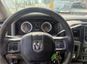 Steering wheel of a 2016 RAM 5500 with dashboard gauges and controls visible