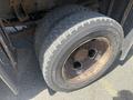 Close-up of a large tire from a 2016 RAM 5500 showing tread pattern and wheel rim