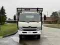 White 2015 Hino 195 truck with a black grille and mounted rack at the front facing forward