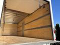 Interior of a 2022 Lion Lion6 truck showing a spacious cargo area with wooden walls and a floor, designed for transporting goods