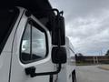 A 2021 Freightliner M2 106 truck with prominent side mirrors and a white cab design