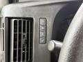 Close-up of control panel buttons in a 2013 Chevrolet Express featuring air conditioning controls and an air vent