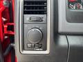 Control panel featuring dials and switches for lighting and vent adjustments on a 2013 RAM 2500